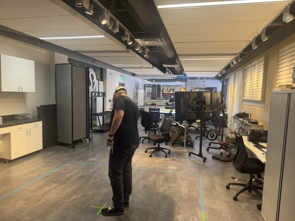 The lab in Tech Commons II, looking toward the windows onto the café, with the driving simulator on the right.